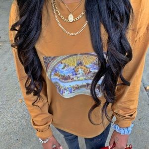 tan long sleeved shirt